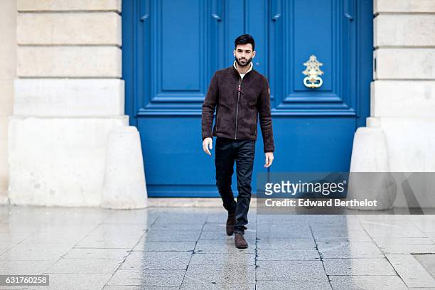 Anil Brancaleoni, life style blogger and Youtuber Wartek, is wearing Tod's brown denim shoes, Replay black pants, and a Napapijri coat, on January...