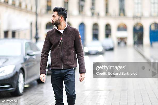 Anil Brancaleoni, life style blogger and Youtuber Wartek, is wearing Tod's brown denim shoes, Replay black pants, and a Napapijri coat, on January...