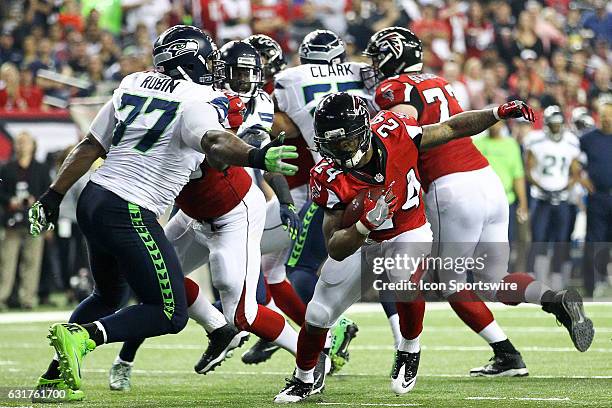 Atlanta Falcons running back Devonta Freeman runs for a first down during the second half of the NFC Divisional Playoff game between the Seattle...