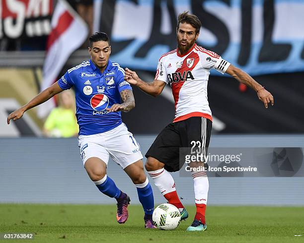 River Plate midfielder Leonardo Ponzio is defended by Millonarios forward Christian Daniel Arango Duque during the first half of a Florida Cup...