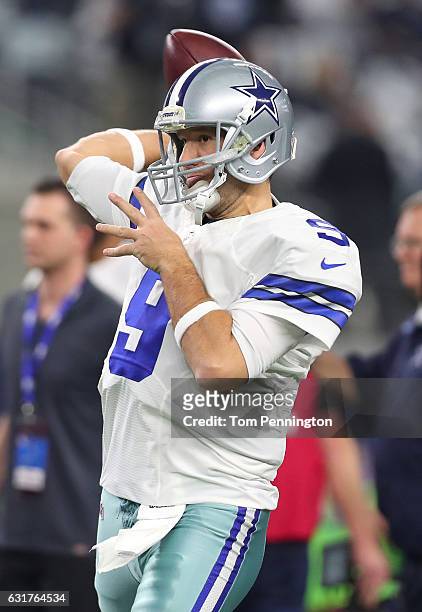 Tony Romo of the Dallas Cowboys warms up on the field prior to the NFC Divisional Playoff game against the Green Bay Packers at AT&T Stadium on...