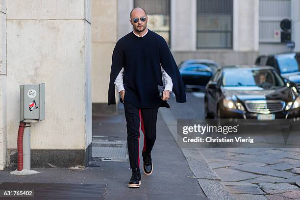 Milan Vukmirovic wearing a knit, black pants during Milan Men's Fashion Week Fall/Winter 2017/18 at Salvatore Ferragamo on January 15, 2017 in Milan,...