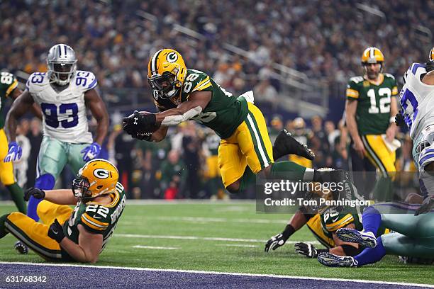 Ty Montgomery of the Green Bay Packers dives into the end zone to score a touchdown during the second quarter against the Dallas Cowboys in the NFC...