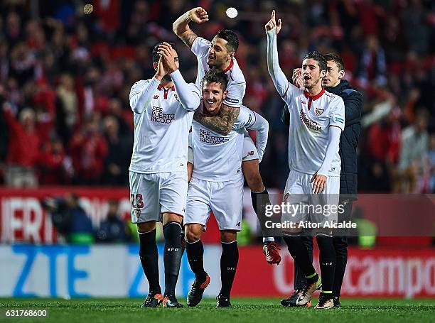 Adil Rami, Victor Machin Perez "Vitolo", Stevan Jovetic and Sergio Escudero of Sevilla FC celebrates after winning the match against Real Madrid CF...