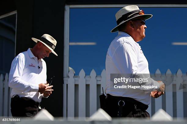 Umpires Marais Erasmus of South Africa and Paul Reiffel of Australia take the field during day five of the First Test match between New Zealand and...