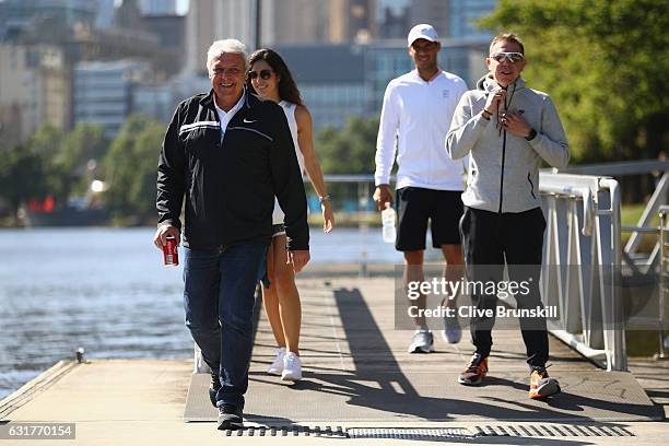 Father Sebastian Nadal, girlfriend Xisca Perello and Rafael Nadal of Spain relax as they walk along the Yarra River ahead of the 2017 Australian Open...