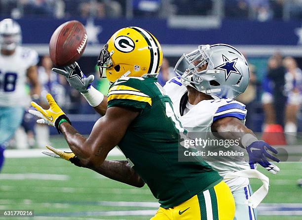 Davante Adams of the Green Bay Packers makes a catch while being defended by Byron Jones of the Dallas Cowboys in the first half during the NFC...