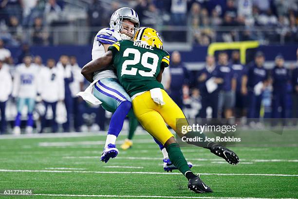 Kentrell Brice of the Green Bay Packers tackles Cole Beasley of the Dallas Cowboys in the first half during the NFC Divisional Playoff Game at AT&T...