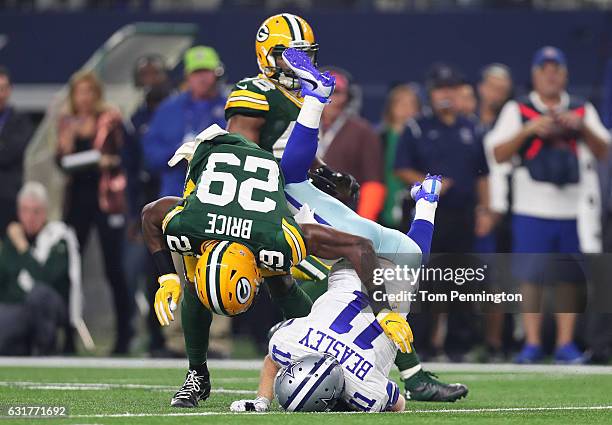 Cole Beasley of the Dallas Cowboys is tackled by Kentrell Brice of the Green Bay Packers after catching a pass during the second quarter in the NFC...