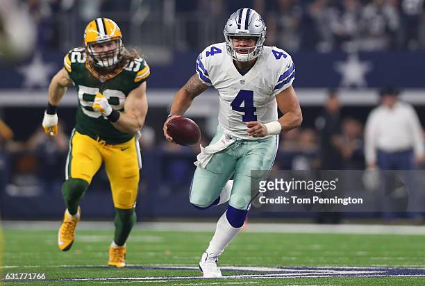 Dak Prescott of the Dallas Cowboys carries the ball during the second quarter against the Green Bay Packers in the NFC Divisional Playoff game at...