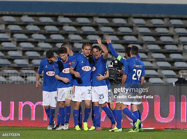 Belenenses's defender Goncalo Silva from Portugal celebrates with teammates after scoring a goal during the Primeira Liga match between CF Os...