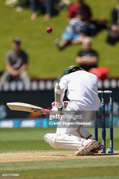 Mushfiqur Rahim of Bangladesh goes to ground after being struck in the helmet by a delivery from Tim Southee of New Zealand during day five of the...