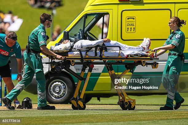 Mushfiqur Rahim of Bangladesh is stretchered into an ambulance after being struck in the helmet by a delivery from Tim Southee of New Zealand during...