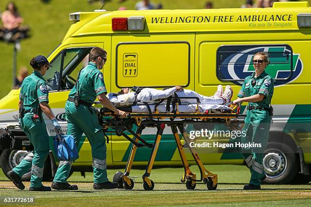 Mushfiqur Rahim of Bangladesh is stretchered into an ambulance after being struck in the helmet by a delivery from Tim Southee of New Zealand during...