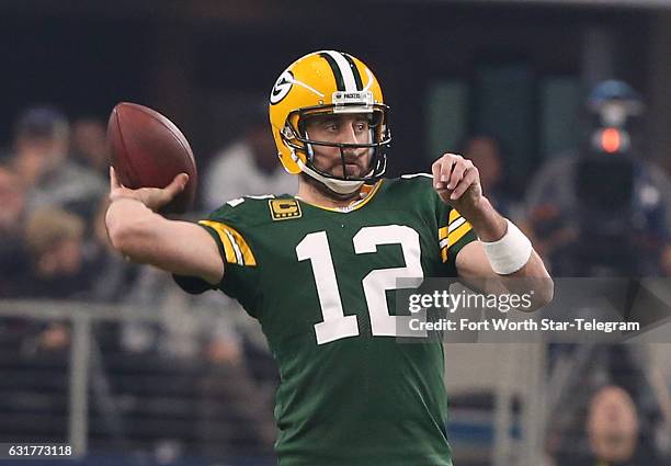 Green Bay Packers quarterback Aaron Rodgers throws against the Dallas Cowboys in the NFL divisional playoffs on Sunday, Jan. 15, 2017 in AT&T Stadium...