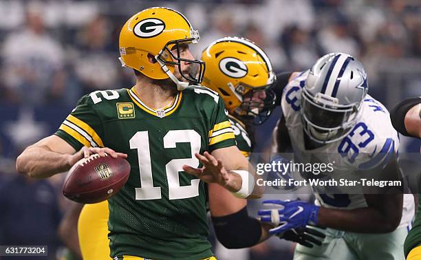 Green Bay Packers quarterback Aaron Rodgers throws in the second quarter against the Dallas Cowboys in the NFL divisional playoffs on Sunday, Jan....