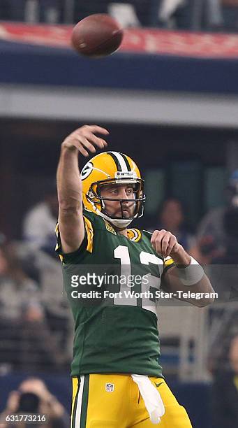 Green Bay Packers quarterback Aaron Rodgers throws in the second quarter against the Dallas Cowboys in the NFL divisional playoffs on Sunday, Jan....