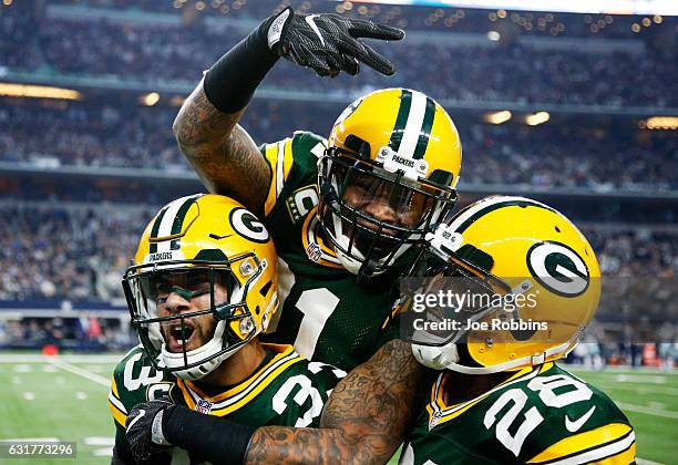 Micah Hyde, Ha Ha Clinton-Dix, and Josh Hawkins of the Green Bay Packers celebrate in the second half during the NFC Divisional Playoff Game against...