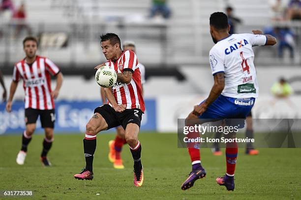 Estudiantes forward Carlos Auzqui takes a pass to the body during the first half of the Florida Cup game between Bahia and Estudiantes on January 15...