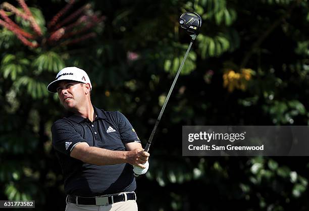 Chez Reavie of the United States plays his shot from the fifth tee during the final round of the Sony Open In Hawaii at Waialae Country Club on...