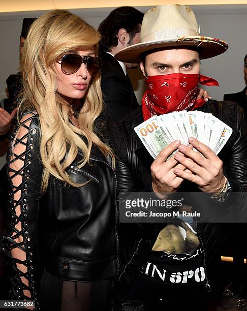 Paris Hilton and Alec Monopoly attend Philipp Plein Boutique Opening during Milan Men's Fashion Week Fall/Winter 2017/18 on January 15, 2017 in...