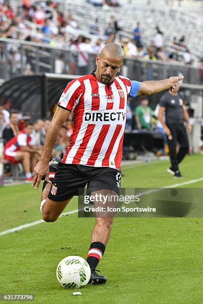 Estudiantes midfielder Juan Sebastian Veron takes a free kick during the first half of the Florida Cup game between Bahia and Estudiantes on January...