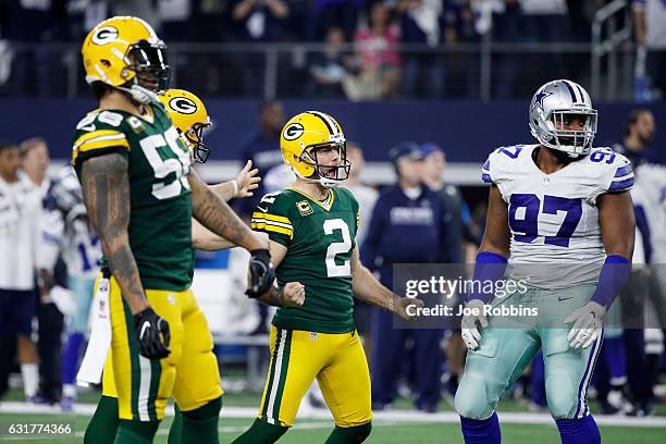 Mason Crosby of the Green Bay Packers reacts after kicking a field goal in the second half during the NFC Divisional Playoff Game against the Dallas...