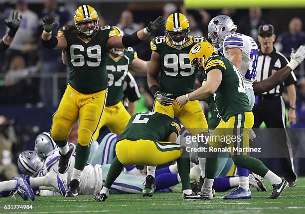 Mason Crosby of the Green Bay Packers celebrates after kicking the game-winning field goal against the Dallas Cowboys in the NFC Divisional Playoff...