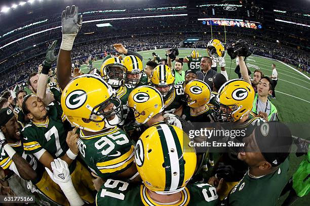 The Green Bay Packers celebrate after Mason Crosby of the Green Bay Packers kicked a last second field goal to defeat the Dallas Cowboys in the NFC...