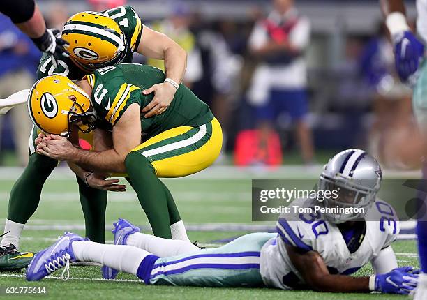 Mason Crosby of the Green Bay Packers celebrates with Jacob Schum of the Green Bay Packers after kicking the game winning field goal against the...