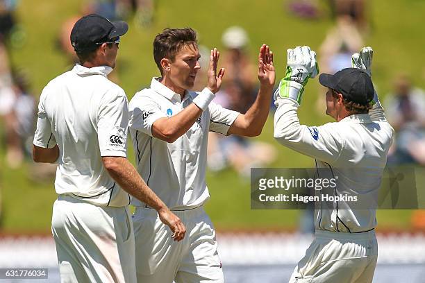 Trent Boult of New Zealand celebrates with teammate BJ Watling after dismissing Sabbir Rahman of Bangladesh during day five of the First Test match...