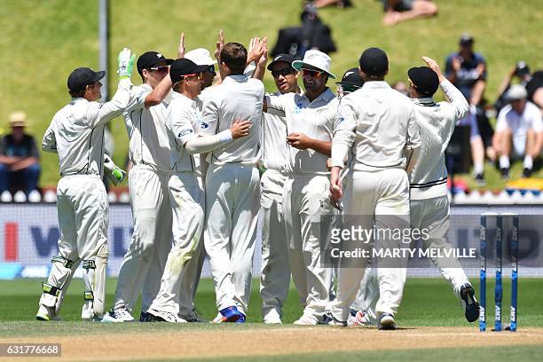New Zealand players celebrate Bangladesh's Sabbir Rahman being caught during day five of the first international Test cricket match between New...