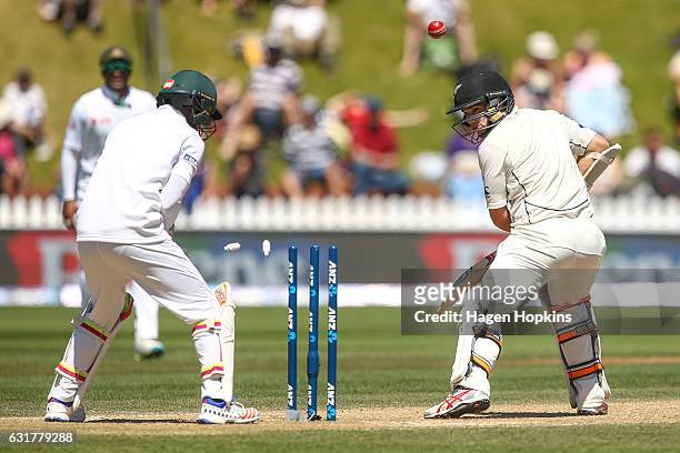 Tom Latham of New Zealand is bowled out by Mehidy Hassan Miraz of Bangladesh while Sabbir Rahman looks on during day five of the First Test match...