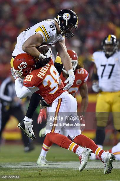 Free safety Ron Parker of the Kansas City Chiefs makes a tackle on tight end Jesse James of the Pittsburgh Steelers during the first quarter in the...