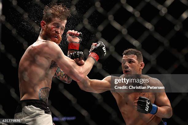 Drakkar Klose lands a right on Devin Powell during the UFC Fight Night event at the at Talking Stick Resort Arena on January 15, 2017 in Phoenix,...