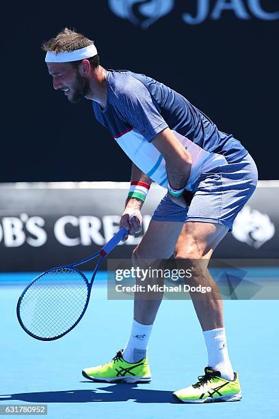 Luca Vanni of Italy reacts to an injury in his first round match against Tomas Berdych of the Czech Republic on day one of the 2017 Australian Open...