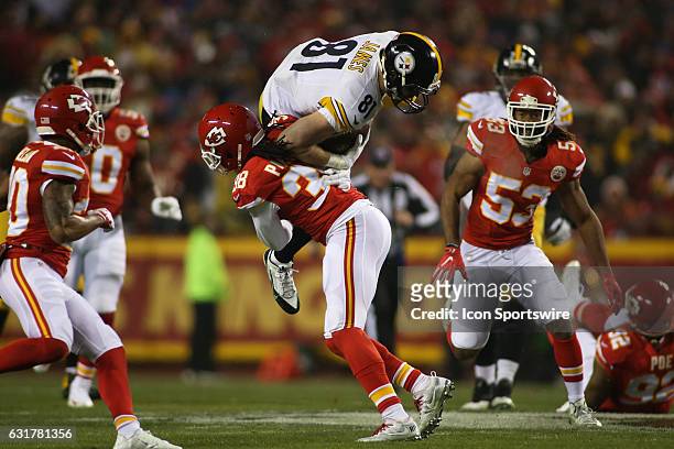 Pittsburgh Steelers tight end Jesse James is upended by Kansas City Chiefs free safety Ron Parker early in the first quarter of the AFC Divisional...