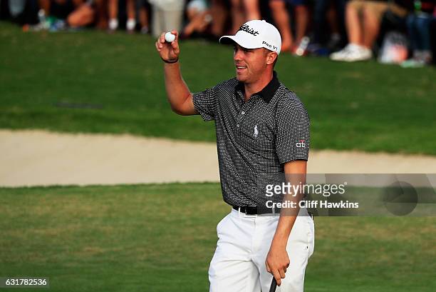 Justin Thomas of the United States celebrates winning on the 18th green after the final round of the Sony Open In Hawaii at Waialae Country Club on...