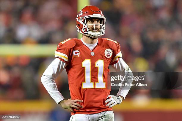 Quarterback Alex Smith of the Kansas City Chiefs looks at the replay after a holding call negated a game tying two point conversion against the...