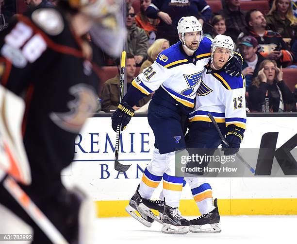 Patrik Berglund of the St. Louis Blues celebrates his goal with Jaden Schwartz for a 2-1 overtime win as John Gibson of the Anaheim Ducks skates to...