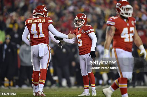 Kicker Cairo Santos of the Kansas City Chiefs high fives teammate James Winchester after a successful field goal against the Pittsburgh Steelers in...