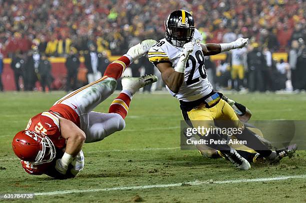 Fullback Anthony Sherman of the Kansas City Chiefs is tackled by defensive back Cortez Allen of the Pittsburgh Steelers during the fourth quarter in...