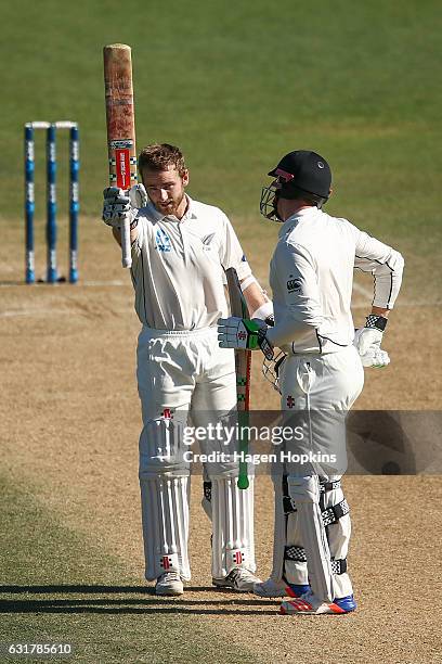 Kane Williamson of New Zealand celebrates his century with teammate Henry Nicholls during day five of the First Test match between New Zealand and...