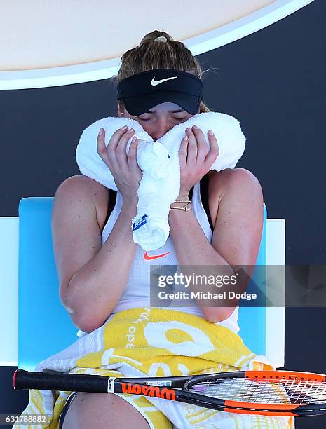 Elina Svitolina of the Ukraine cools down during her first round match against Galina Voskoboeva of Kazikstan on day one of the 2017 Australian Open...