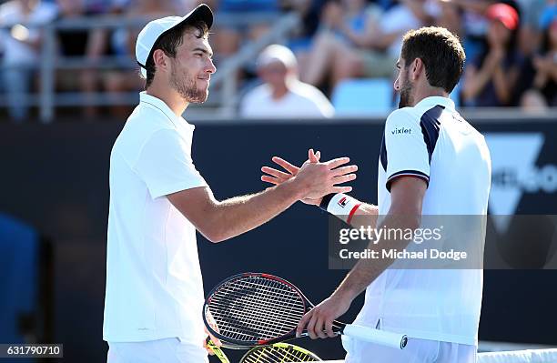 Jerzy Janowicz of Poland congratulates Marin Cilic of Croatia on winning their first round match on day one of the 2017 Australian Open at Melbourne...