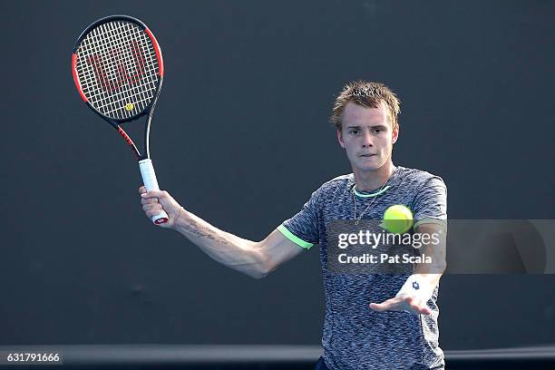 Alexander Bublik of Kazakhstan plays a forehand in his first round match against Lucas Pouille of France on day one of the 2017 Australian Open at...