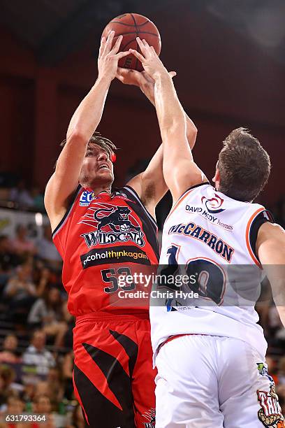 Damian Martin of the Wildcats shoots during the round 15 NBL match between the Cairns Taipans and the Perth Wildcats at Cairns Convention Centre on...