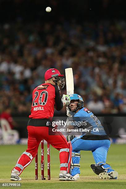 Tim Ludeman of Adelaide plays a shot over Peter Nevill of Melbourne during the Big Bash League match between the Adelaide Strikers and the Melbourne...