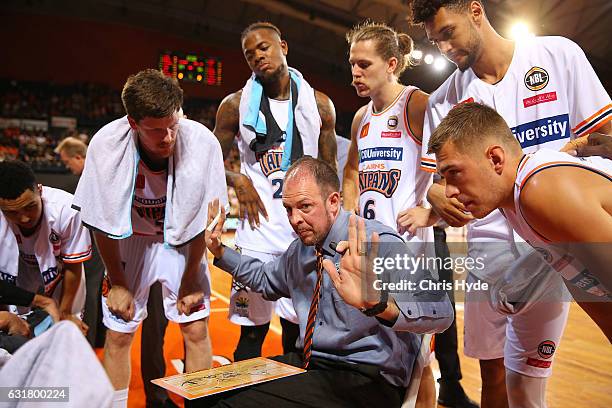 Taipans coach Aaron Fearne talks to players during the round 15 NBL match between the Cairns Taipans and the Perth Wildcats at Cairns Convention...