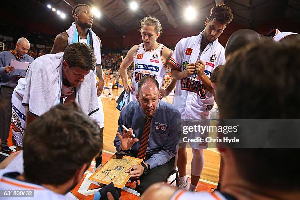 Taipans coach Aaron Fearne talks to players during the round 15 NBL match between the Cairns Taipans and the Perth Wildcats at Cairns Convention...